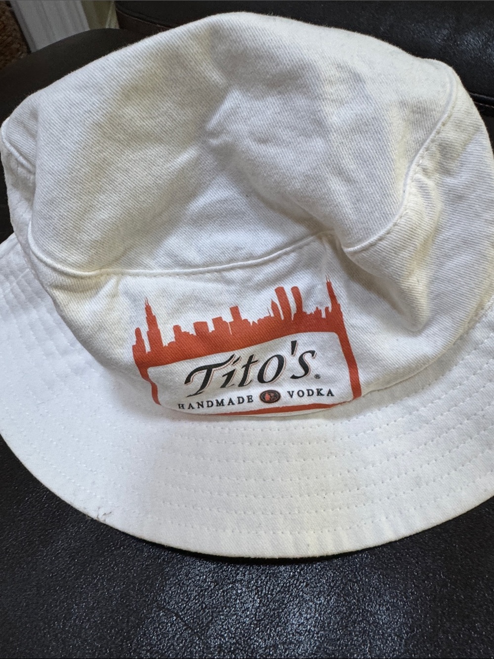 White unisex Bucket Hat with Orange Logo